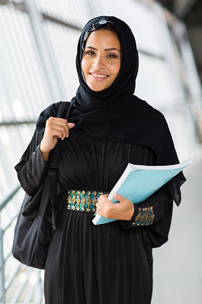 istock female arabian college student holding a book 511864519