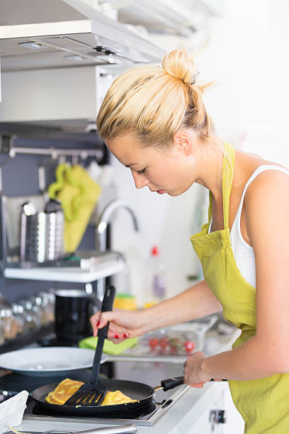 istock Young Mother Cooking at Home. 511865001
