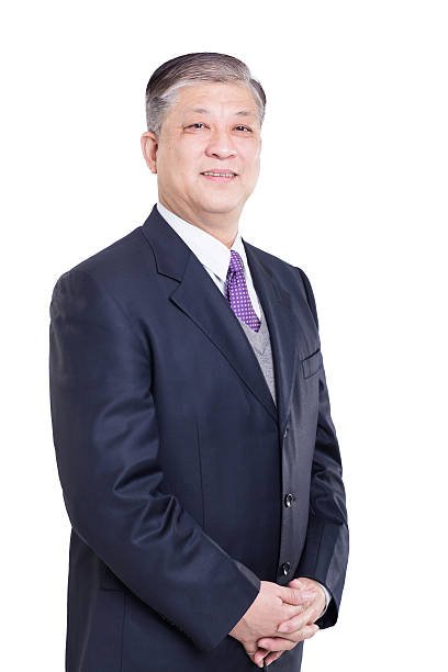 istock old Asian businessman in black suit 511865030