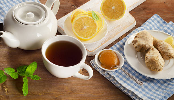 istock Teapot and cup of tea with lemon, ginger 511865122