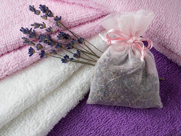 Sachet of the lavender herb and cotton towels stock photo