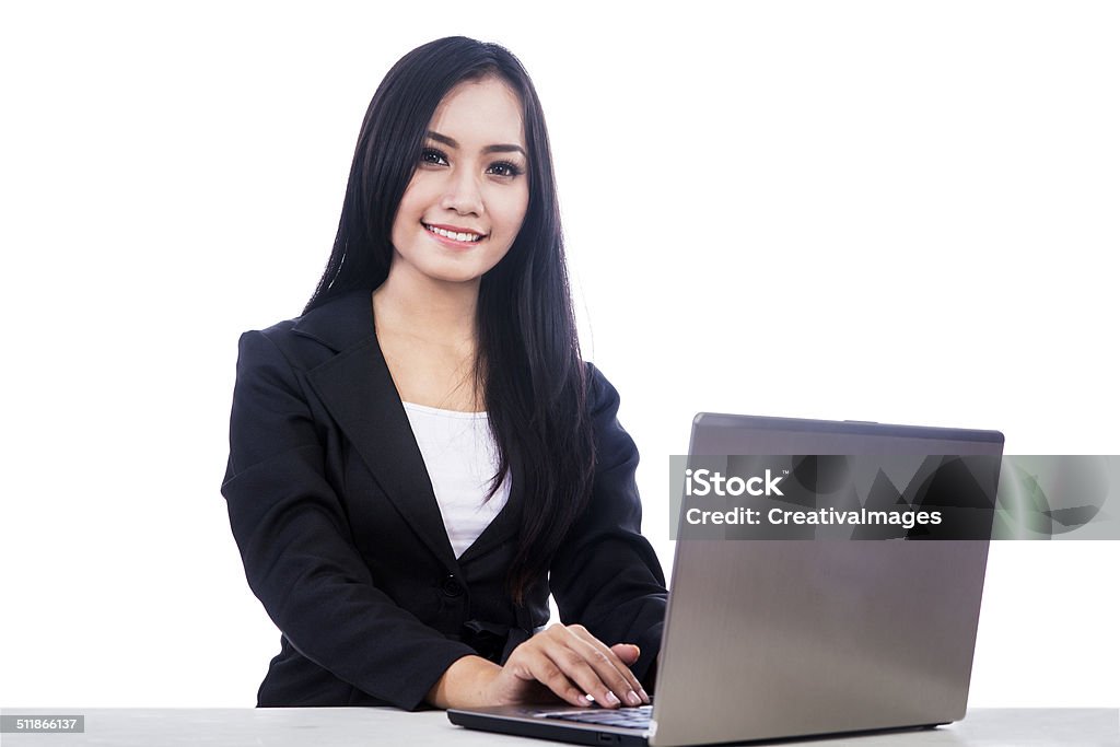 Businesswoman smiling at camera Young businesswoman smiling at camera, isolated over white 20-29 Years Stock Photo