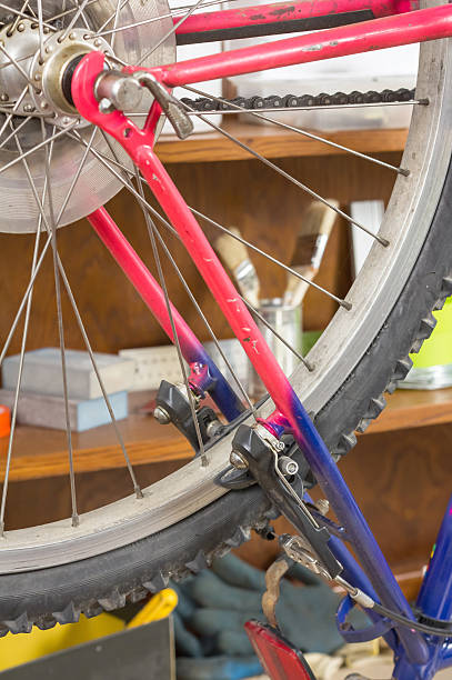 istock Closeup of bike wheel over workshop table 511866155