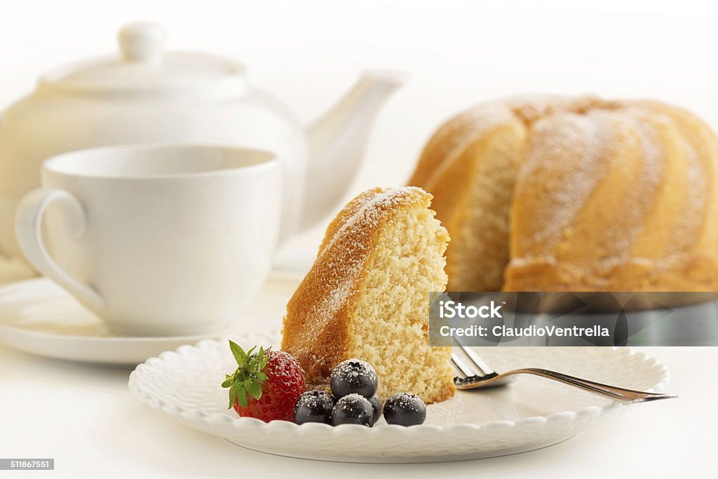 slice of cake with afternoon tea slice of sponge cake and white porcelain Cake Stock Photo
