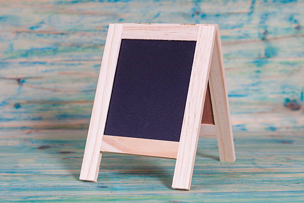 istock small Blackboard on old wood background 511868446