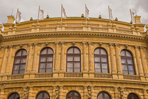 Czech flags on a balcony above the Presidency entrance