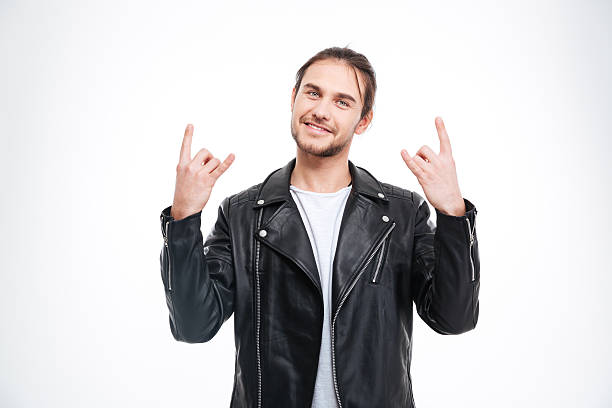 istock Smiling handsome man in black leather jacket doing rock gesture 511868700