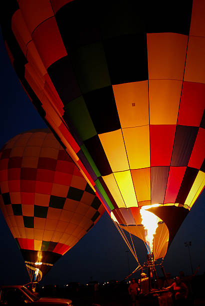 istock Hot Air Balloons at Night with burners lit 511869279