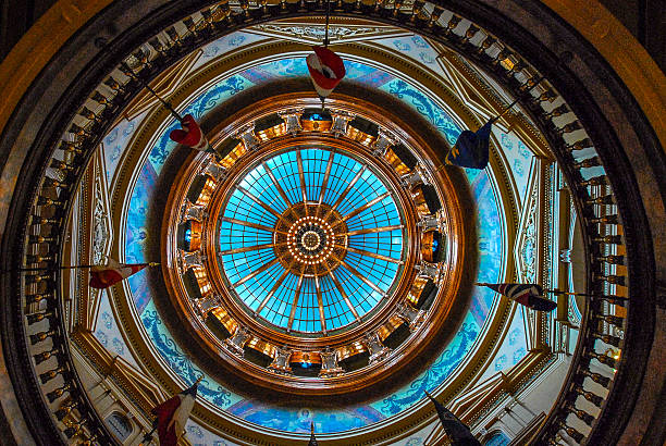 Capital Dome in Kansas Statehouse stained glass rotunda Capital Dome in Topeka Kansas Statehouse. Stained glass with balcony and flags. united states capitol rotunda photos stock pictures, royalty-free photos & images