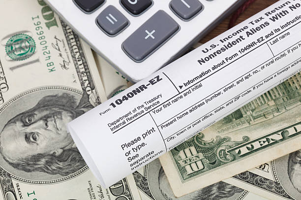 istock Money and calculator With Tax form. 511869498