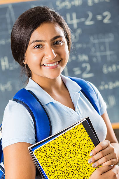 istock Cute preteen Indian student in math class 511869639