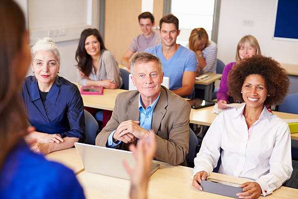 istock Mature Students In Further Education Class With Teacher 511869847