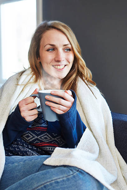 istock Sick girl enjoying hot drink 511870269