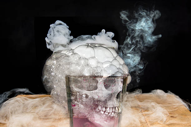 istock Dry ice with skull, bubbles & fog in glass 511870409