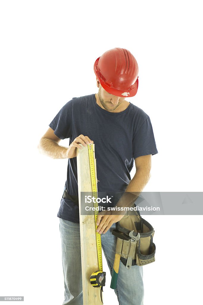 Carpentier man measuring wood Adult Stock Photo