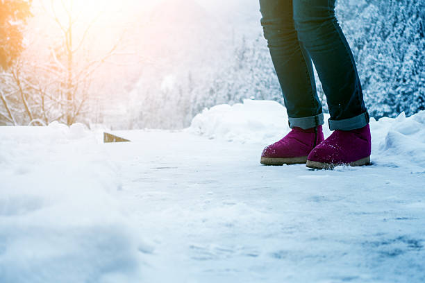 Woman with shoes on snow.