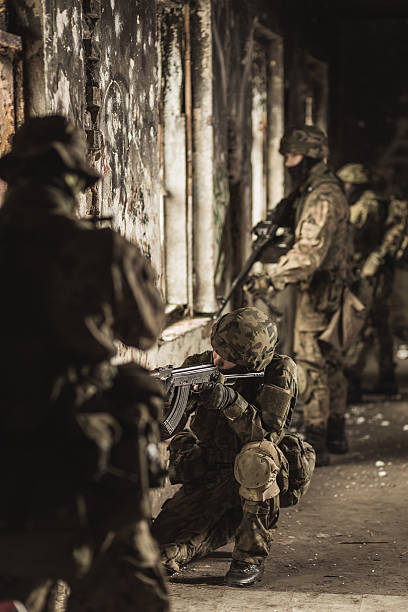 istock Soldiers in camouflage military uniform 511872610