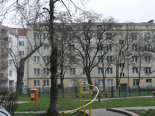 istock grey eastern bloc housing lightened by children's playground 511874910