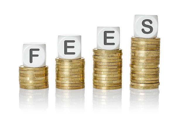 istock Coin stacks with letter dice - Fees 511875092