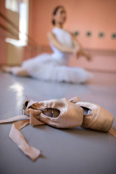 istock Ballet pumps with ballerina in the background. 511875146