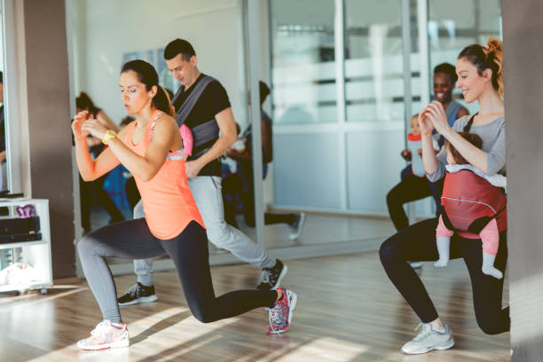 istock Parents Exercising with Their Babies in a Gym 511878750