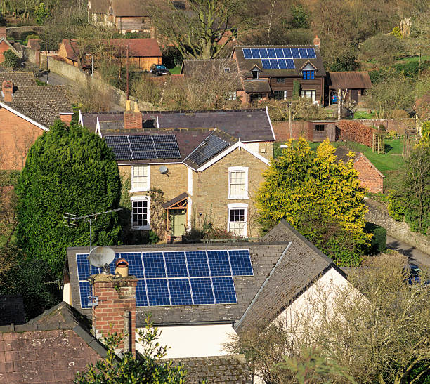 Solar panels on rooftops of houses. In Ludlow, England. Ludlow, England - February 21, 2016: Solar panels on rooftops of houses. ludlow shropshire stock pictures, royalty-free photos & images