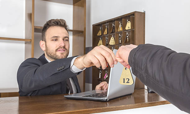 istock Receptionist Giving the Key 511879348