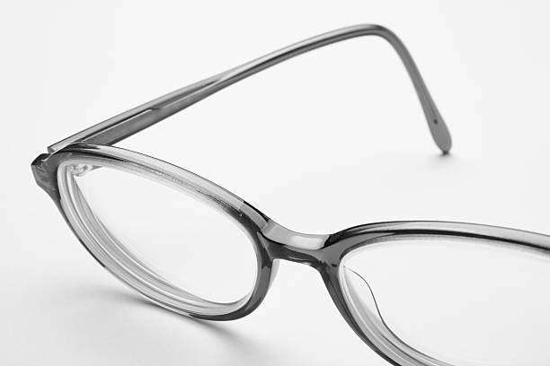 istock Female eyeglasses macro detail over a white background. 511880474