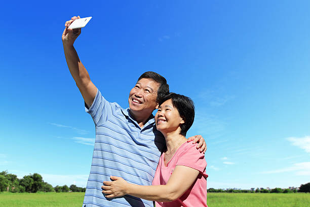 istock Happy elderly seniors couple selfie 511884133