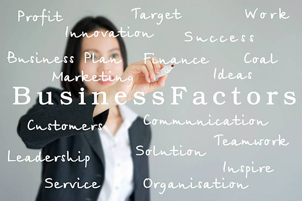 istock Young beautiful businesswoman with pen writing on the screen. 511884805