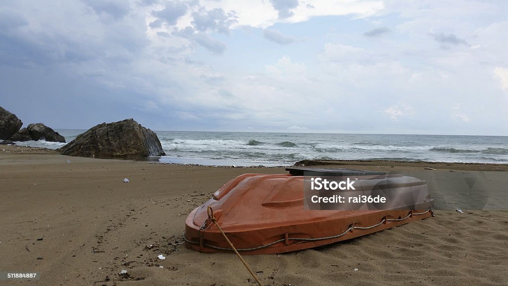 Boat on the beach A boat on the beach of the Black Sea in Turkey Beach Stock Photo