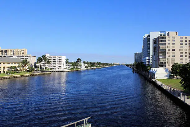 Deep view of the intracoastal waterway north of Oakland Park Boulevard with mostly residential buildings lining both sides in Fort Lauderdale, Florida on an autumn morning