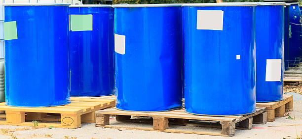 istock Some blue barrels on wooden pallets 511888215