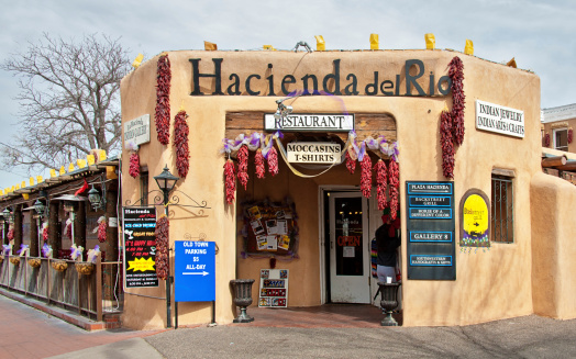 Albuquerque, USA- January 30, 2014: A typical small gallery shop and a restaurant in Albuquerque Historic Old Town Historic Old Town has been the heart of Albuquerque since the city was founded here in 1706.