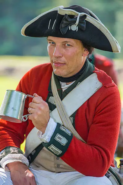 Reenactor British soldier of American Revolution, portraying a private of the 55th Regt. of Foot.