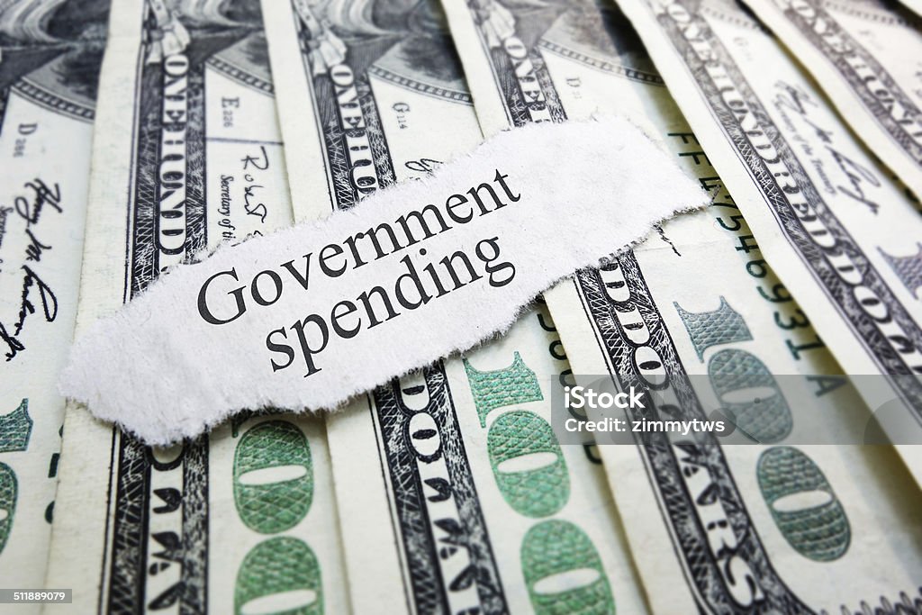 government spending Government Spending newspaper headline on assorted money Government Stock Photo