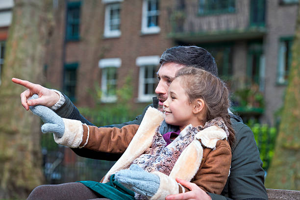 istock Father and Daughter in Park, London UK 511889763