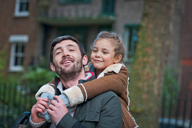 istock Father and Daughter in Park, London UK 511889773