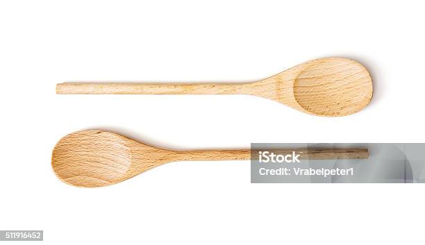 Two Wooden Spoons On The White Background Stock Photo - Download Image Now - Wooden Spoon, Spoon, Wood - Material