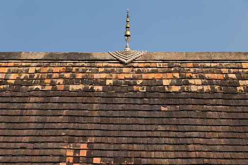 Chiang Mai, Thailand - February 13, 2016: the design of ancient buddhism temple roof at Intrawart temple.