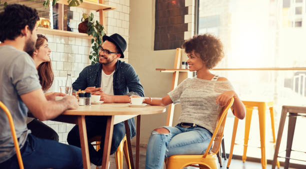 istock Young friends relaxing in cafe 511918346