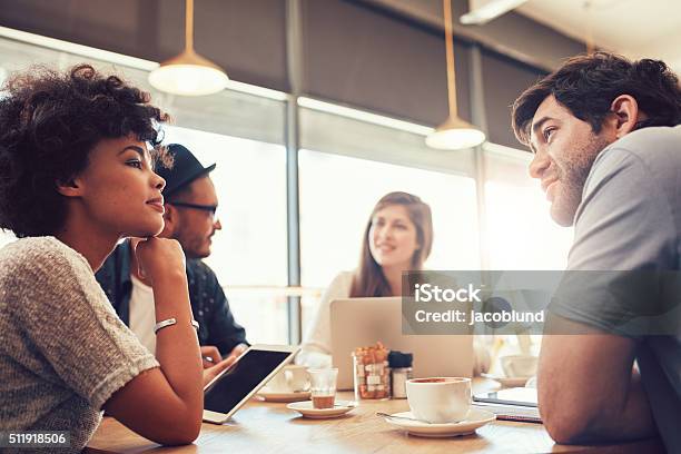Group Of People At Coffee Shop For Startup Meeting Stock Photo - Download Image Now - Coffee - Drink, Business Casual, Working