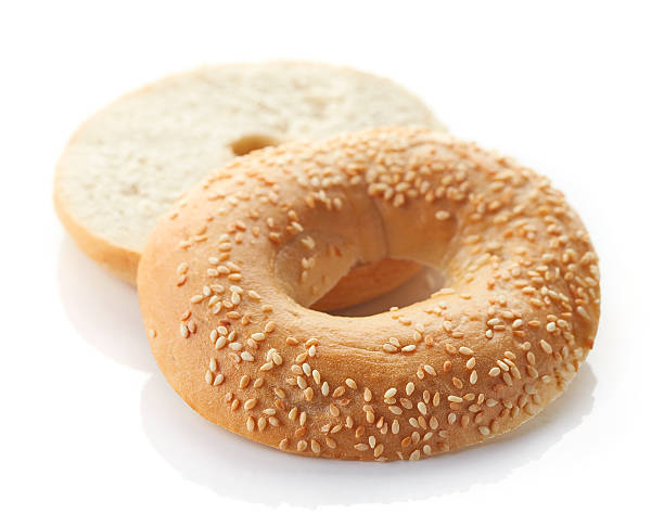 istock Fresh sesame bagel isolated on white background 511919240