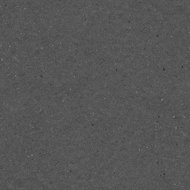 Seamless messy dotted polluted manufactured dark gray paper background pattern