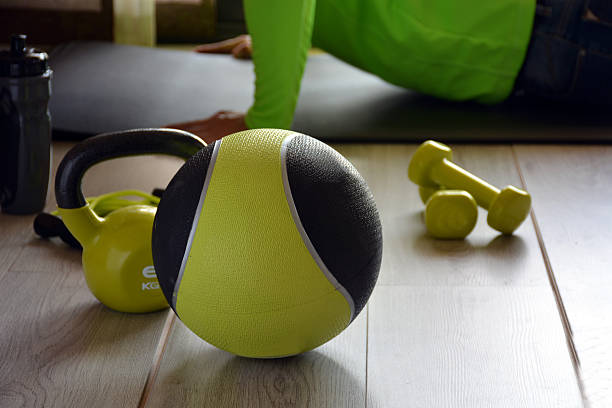 ketlebell with medicine ball ketlebell with medicine ball and two dumbbells and a rope to jump military camp stock pictures, royalty-free photos & images