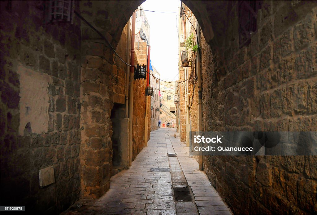 Medieval narrow street Old narrow street paved with stone, arch Alley Stock Photo