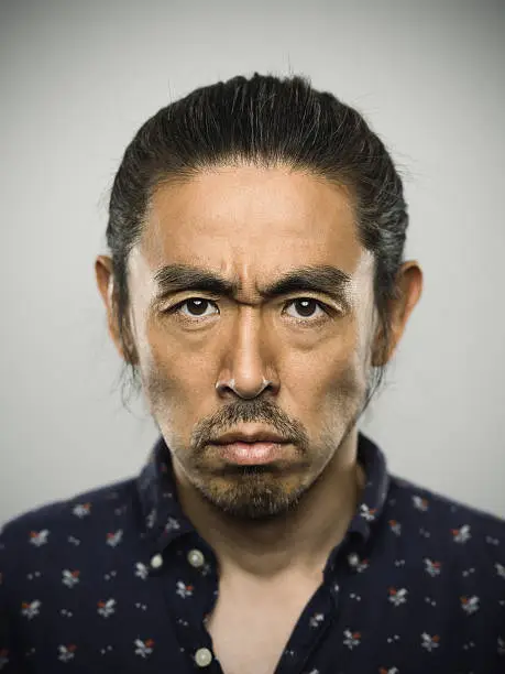 Photo of Portrait of a japanese man looking at camera.