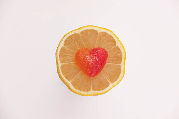istock Red heart on the middle of lemon slice. 511923158