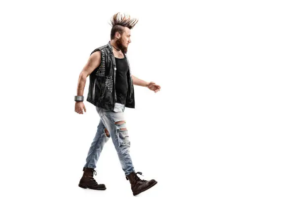 Photo of Angry male punk rocker walking