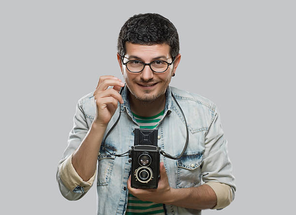 istock Photographer with a vintage camera 511927322
